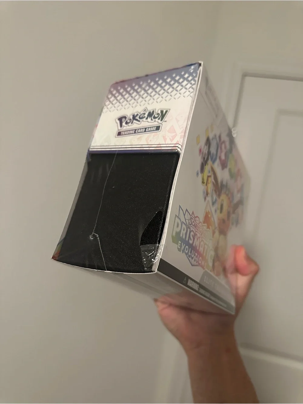 Pokémon TCG: Scarlet & Violet—Prismatic Evolutions Elite Trainer Box *SMALLTEAR*